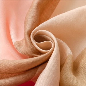 Close-up of soft cotton linen scarf showing delicate woven texture and pastel tones
