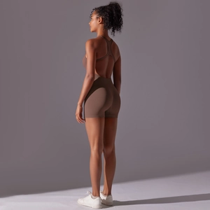 Detailed back view of a brown backless yoga jumpsuit with a ribbed seamless texture