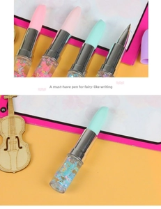 Detail of creative lipstick-shaped pens with colorful quicksand and macaron finishes