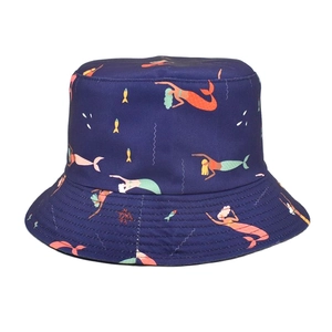 Detail of double-sided bucket hat featuring vibrant ocean mermaid and coral prints