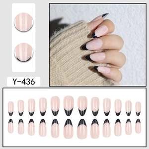Almond press-on nails with black French tips and white spider web patterns for Halloween