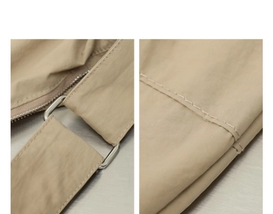 Dettaglio della cerniera argentata e cuciture precise sulla borsa in nylon beige