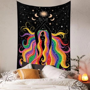 Detail view of bohemian tapestry with rainbow hair silhouette and stars in a cozy bedroom
