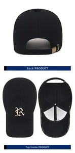 Detail der schwarzen Winter-Baseballkappe mit goldener R-Stickerei und Metallschnalle