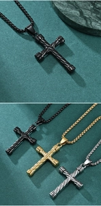 Detailed view of twisted rope cross pendants in black, gold, and silver stainless steel