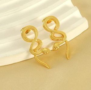 Detail showing snake scales texture and gold plating on stainless steel earrings