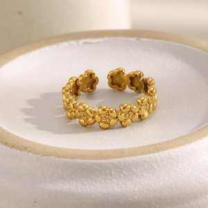 Detailed view of floral 18K gold plated stainless steel ring with adjustable open design
