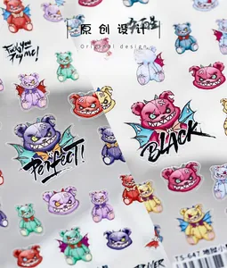 Close-up of 5D embossed nail stickers featuring colorful punk demon bears and wings
