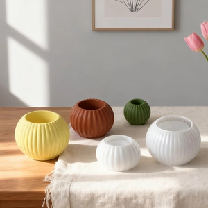 Modern minimalist striped resin candle holder and vase set in various matte earth tones