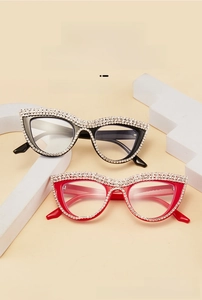 Detail of cat-eye reading glasses with hand-set rhinestones and blue light blocking lenses