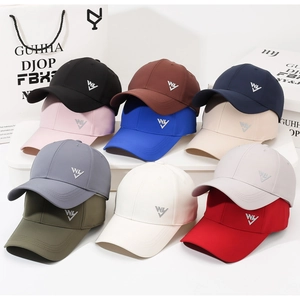 Detailed view of multiple colorful quick-dry baseball caps with WY letter embroidery
