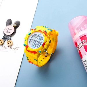Kids digital watch with yellow camouflage strap and colorful LED backlit display