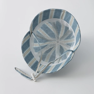 Detailed inner view of striped baby sun hat showing adjustable chin strap and soft lining