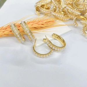 18k gold plated C-shape hoop earrings with white pearls and twisted metal texture