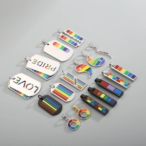 Detailed view of rainbow pride necklaces including dog tags and pendants in stainless steel