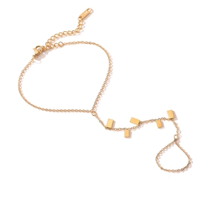 Detailed macro of 18K gold plated stainless steel hand chain with square charms