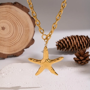Golden starfish pendant necklace with hammered texture and heavy linked chain
