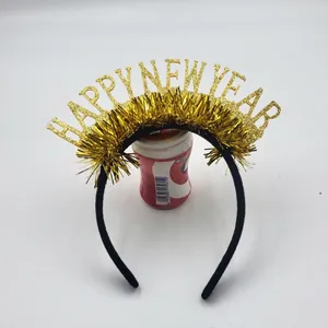 Close-up of Happy New Year headband with gold glitter lettering and festive tinsel décor