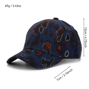 Navy baseball cap with red spots and gold glitter trim, 7cm brim, 12cm height, side view
