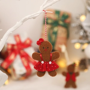 Gingerbread man plush ornament with red polka dot dress for Christmas tree decor