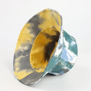 Detail of colorful tie-dye bucket hat showing stitching and yellow inner lining