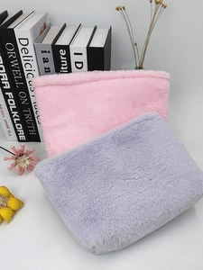 Pastel plush macaron cosmetic bags in pink and purple for soft travel storage