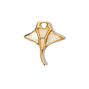 Detailed close-up of golden stingray pendant featuring inlaid mother of pearl texture