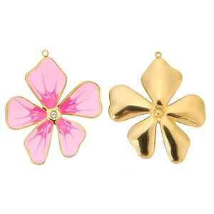 Detail of flower charm pendant featuring pink enamel oil drop and sparkling crystal inlay