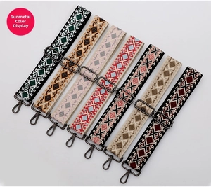 Detailed view of ethnic style woven bag straps with gunmetal gray hardware buckles