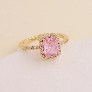 Fashionable golden halo ring featuring a rectangular pink zircon stone with micro-pave details