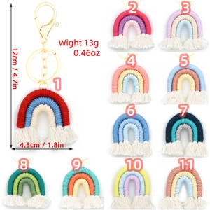 Handmade woven rainbow keychain collection with cotton tassels and gold metal lobster clasps