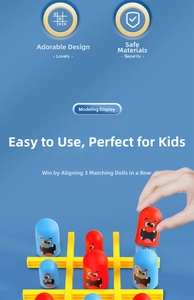 Detail showing the tic-tac-toe game grid with cute red and blue monster toys for kids