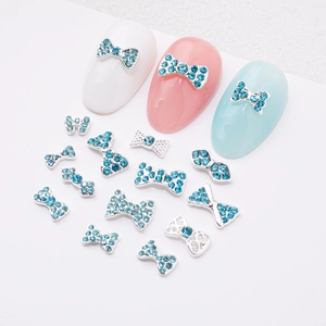 Blue rhinestone bow nail art charms set with silver alloy crystals for manicure decor
