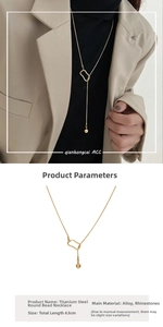 Detail of a minimalist titanium steel bead Y-necklace showing its elegant 63cm adjustable length