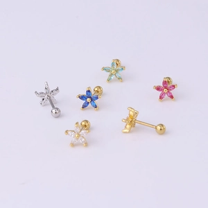 Detailed macro view of 20G stainless steel daisy stud earrings with colorful zirconia