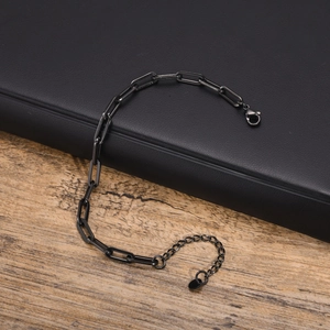 Detail view of gunmetal paperclip link bracelet with lobster clasp and extension chain