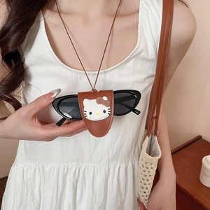 Detail of Hello Kitty leather glasses holder necklace showing secure sunglass storage