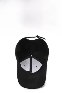 Detail view of the breathable white mesh lining and adjustable strap on a black baseball cap