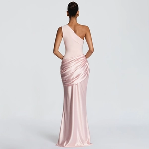 Detail of slim fit pink satin evening gown with elegant back ruching and off-shoulder design