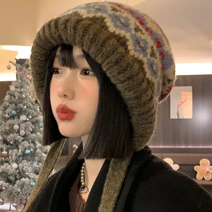 Vintage Fair Isle knit beanie with earflaps and tassels in a warm brown geometric pattern