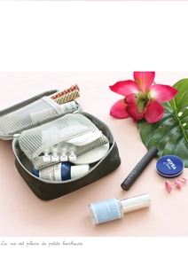 Detail view of the deep gray travel organizer bag featuring internal mesh storage pockets