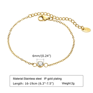 Macro detail of gold stainless steel bracelet showing K18 hallmark and 6mm zircon stone