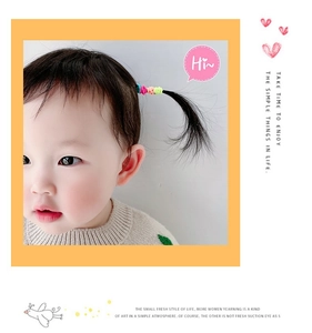 Detailed view of colorful elastic hair ties for kids on a high-stretch soft texture