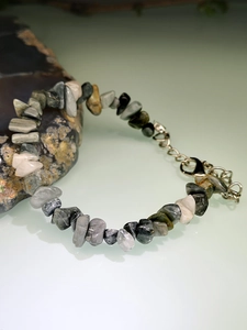 Detail of multi-color natural raw stone bracelet with adjustable silver lobster clasp