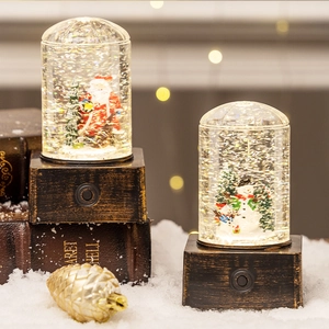 Luminous Christmas snow globe lantern with Santa Claus and snowman in vintage wood base