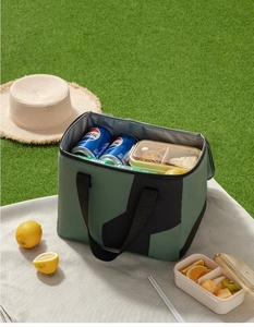 Detail of the insulated interior lining of the forest green portable picnic bag