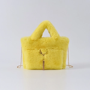 Yellow faux rabbit fur tote bag with gold chain strap and deer metal charm accent