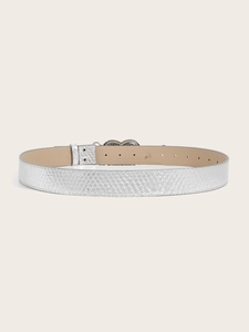 Detail of silver snakeskin texture belt with beige lining and sleek metal buckle