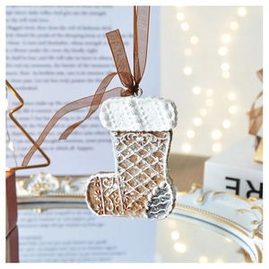 Detail of gingerbread resin Christmas stocking ornament with intricate textured patterns