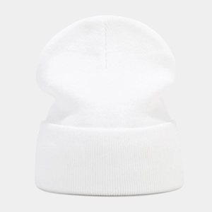 Detail of pure white knitted beanie featuring high-quality tight ribbed texture and cuff